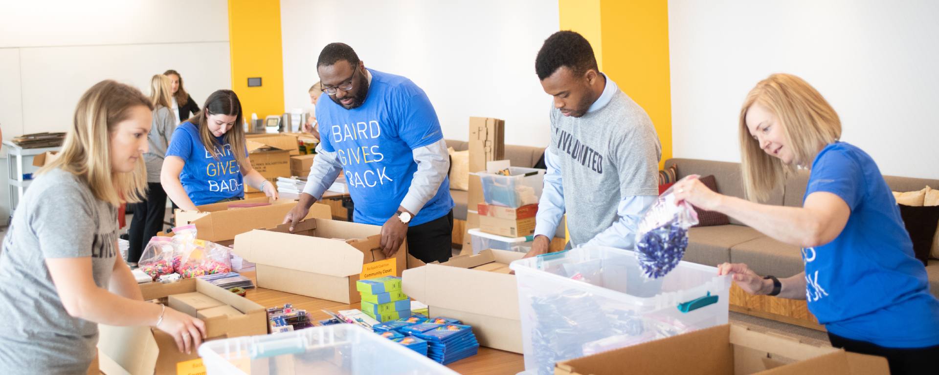 Group of Liberty Associates packing food boxes.