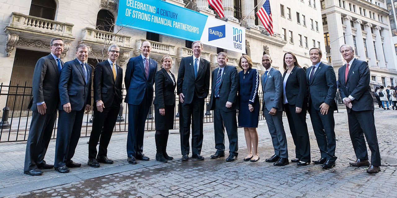  Liberty Executive Committee standing in front of the New York Stock Exchange building.